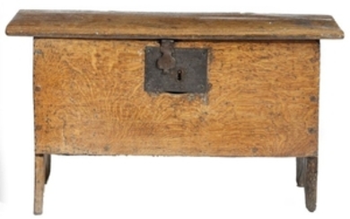 A small early 17th century oak boarded coffer, wit…