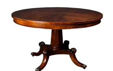 A Regency style band inlaid dining table executed in