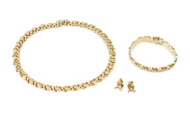 A 14k gold necklace, composed of shaped interlocking links and...