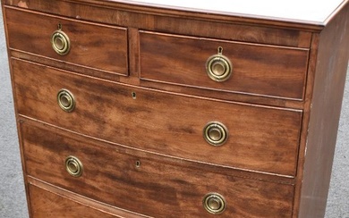 A 19th Century mahogany chest of two over three drawers, with bow front and Regency style brass