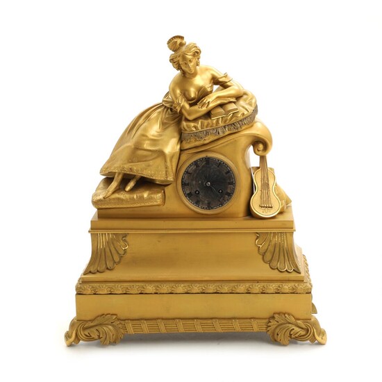 NOT SOLD. A 19th century French bronze mantel clock, surmounted by a reading lady. H. 48 cm. – Bruun Rasmussen Auctioneers of Fine Art