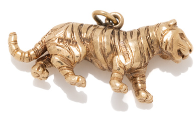A 9CT GOLD TIGER CHARM; size 28 x 14mm, hallmarked...