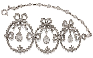 A Belle Epoque diamond-set mount, probably for a necklace, comprising three articulated old-brilliant-cut diamond oval openwork garland graduated panels, each suspending a central pear-shaped diamond drop, together with a short length of diamond...