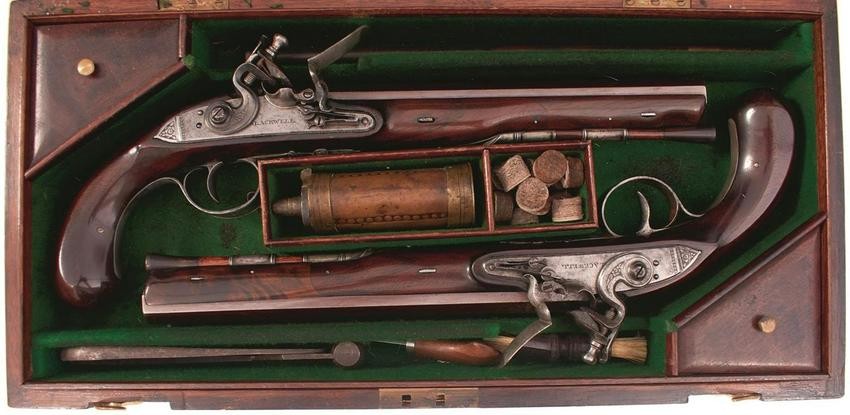 A CASED PAIR OF 18-BORE FLINTLOCK DUELLING PISTOLS BY
