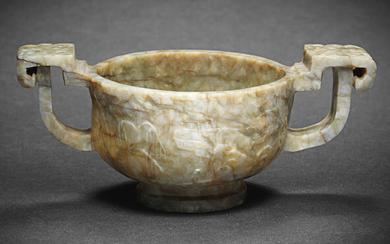 A 'CHICKEN BONE' JADE TWO-HANDLED CUP