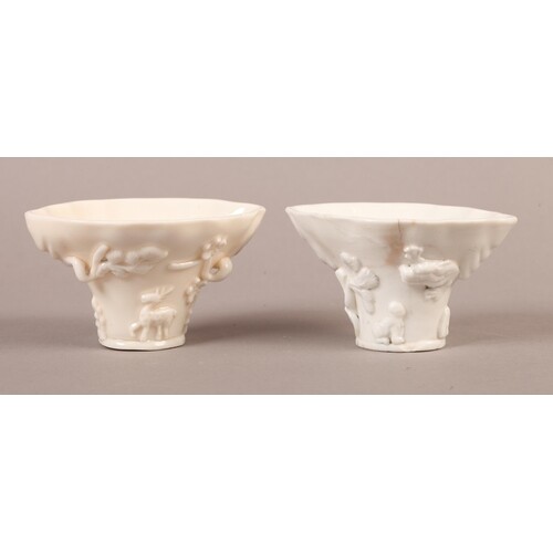 A CHINESE BLANC DE CHINE LIBATION CUP, modelled in relief wi...