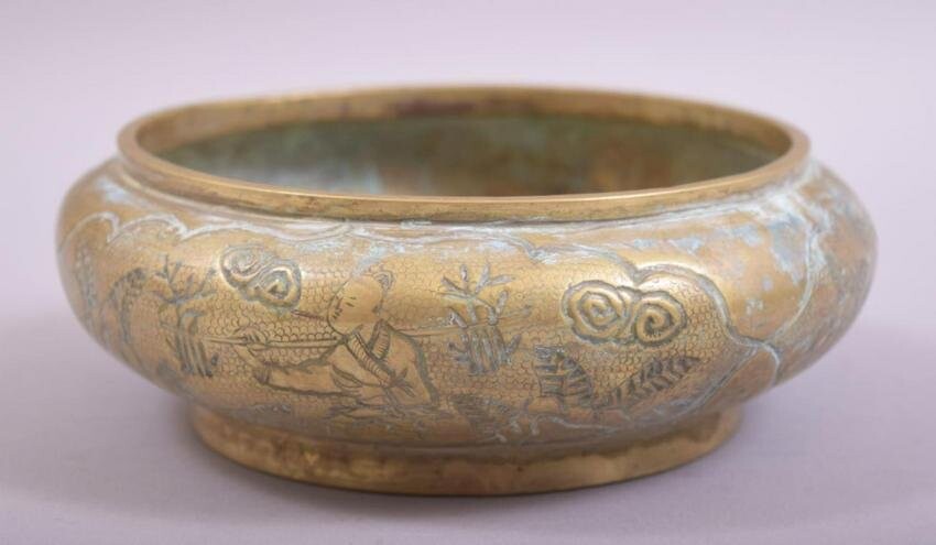 A CHINESE EMBOSSED AND CHASED BRONZE BOWL, with scenes