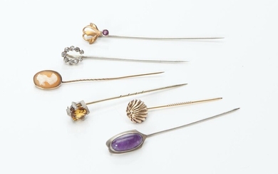A COLLECTION OF SIX STICK PINS INCLUDING AMETHYST, CITRINE AND CAMEO SET IN GOLD AND SILVER