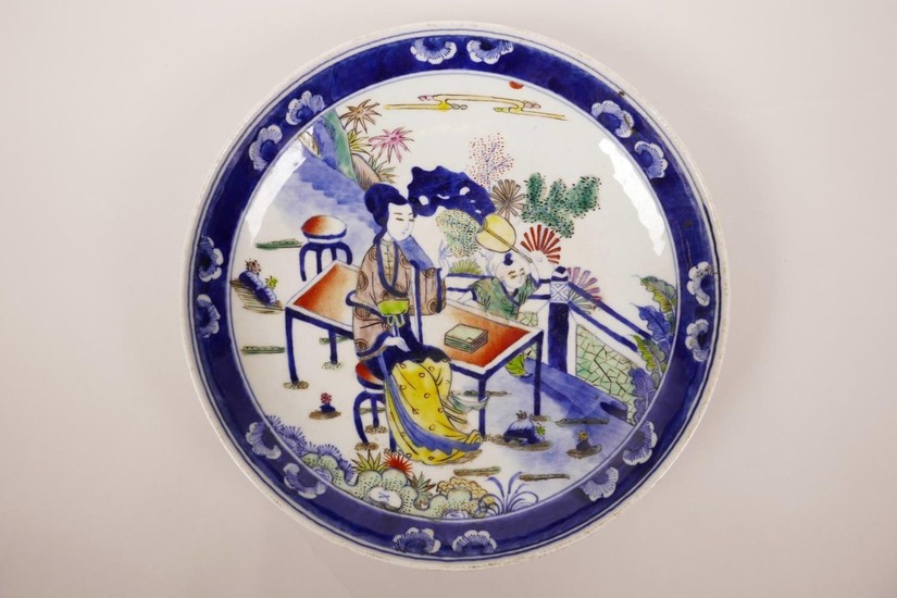 A Chinese blue and white porcelain dish with polychrome enam...