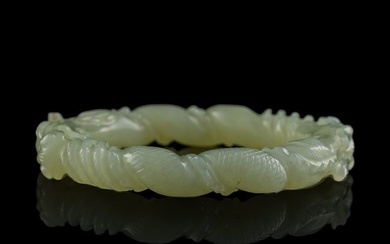 A Chinese carved white jade 'double dragon' bangle, 19th century
