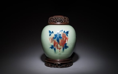 A Chinese celadon-ground blue, white and copper-red ginger jar with reticulated wooden cover and