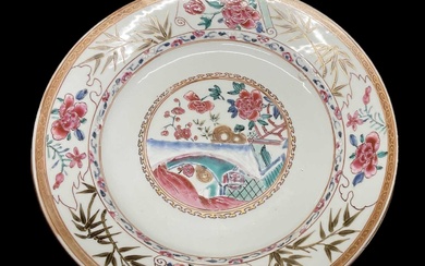 A Chinese Famille Rose porcelain plate decorated with foliage to...