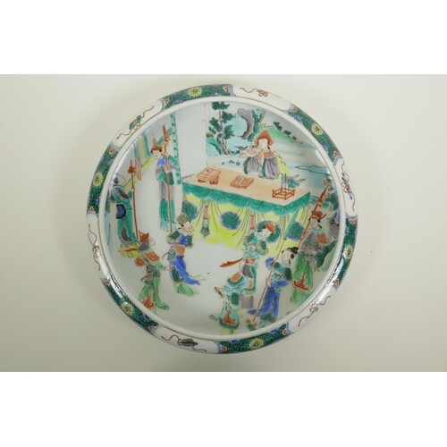 A Chinese famille verte porcelain dish with a rolled rim, de...