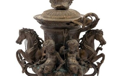 A Continental Cast Metal Urn with Putti and Hippocampi