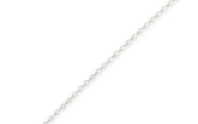A DIAMOND LINE BRACELET in 18ct white gold comprising a