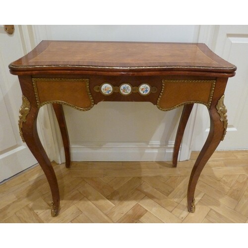 A French style inlaid rectangular games table with applied p...