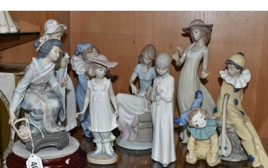 A GROUP OF LLADRO AND NAO FIGURINES, comprising Lladro figur...