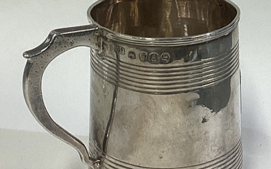 A George III silver reeded mug. London 1819.