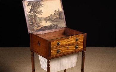 A George IV Mahogany Work Table. The hinged rectangular lid inlaid with ebony stringing and having a