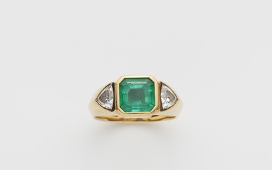 A German 18k gold diamond and Columbian emerald three stone ring.