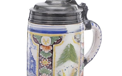 A German 18th century faience tankard with pewter mount painted in colours...