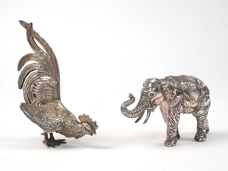 A German silver model of a fighting cockerel, with 1958 London import mark, 13.5cm high, 4.5oz, together with a model of an elephant, stamped 925, designed with raised trunk and realistically textured skin, 8cm high (2)