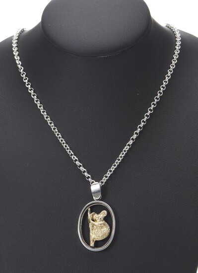 A KOALA PENDANT BY TONY KEAN HANDCRAFTED IN 9CT GOLD AND STERLING SILVER, LENGTH 30MM (INCLUDING THE BALE), SIGNED AND HALLMARKED, BOXE