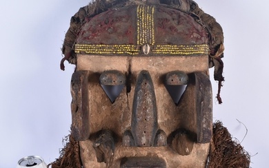 A LARGE AFRICAN TRIBAL CARVED WOOD MASK. 54 cm x 28 cm.