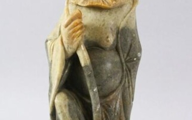 A LARGE CHINESE SOAPSTONE CARVING OF AN IMMORTAL, stood