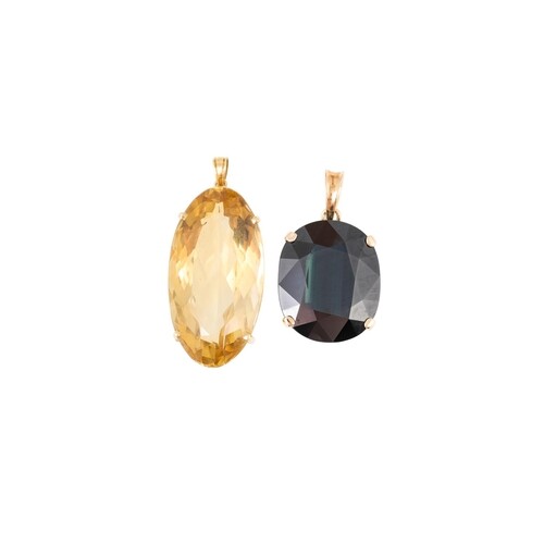 A LARGE SAPPHIRE PENDANT, (greenish hue), mounted in yellow ...