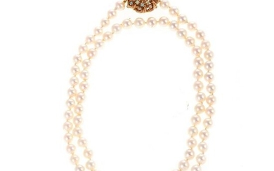 A Long Strand of Pearls with Opal Clasp in 14K