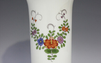 A Meissen porcelain spill vase, 20th century, painted with floral sprays, raised on four scroll feet