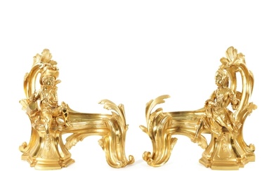 A PAIR OF 19TH CENTURY GILT ORMOLU CHENETS OF ROCOCO CHIPPEN...