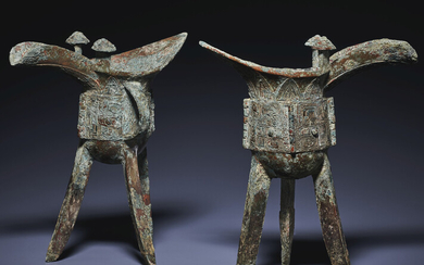 A PAIR OF BRONZE RITUAL TRIPOD WINE VESSELS, JUE, LATE SHANG DYNASTY, 13TH-12TH CENTURY BC
