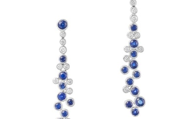 A PAIR OF SAPPHIRE AND DIAMOND DROP EARRINGS each comprising a row of round cut sapphires and round