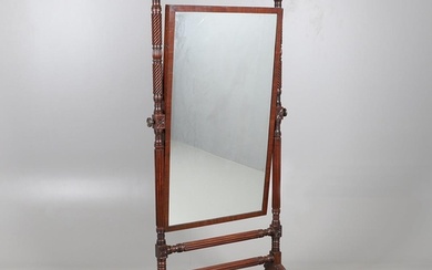 A REGENCY MAHOGANY CHEVAL MIRROR. the frame with turned spir...