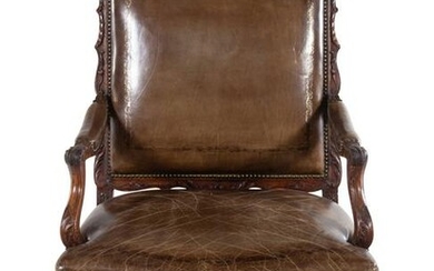 A Regence Style Leather Upholstered Carved Walnut