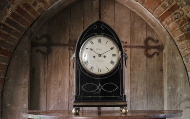 A Regency ebonised table clock