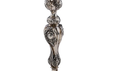 A Russian silver candlestick, embossed with rocailles and stylized flowers and foliage....