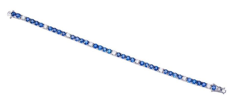 A SAPPHIRE AND DIAMOND LINE BRACELET-Comprising thirty five sapphires totalling 12.80cts and nine round brilliant cut diamond total...