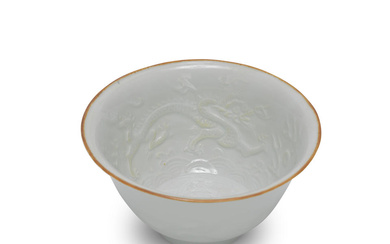 A SMALL MOULDED WHITE-GLAZED DRAGON BOWL Mid-17th century