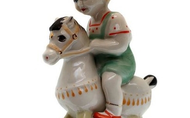 A SOVIET PORCELAIN FIGURINE BOY RIDING A HORSE ZHK