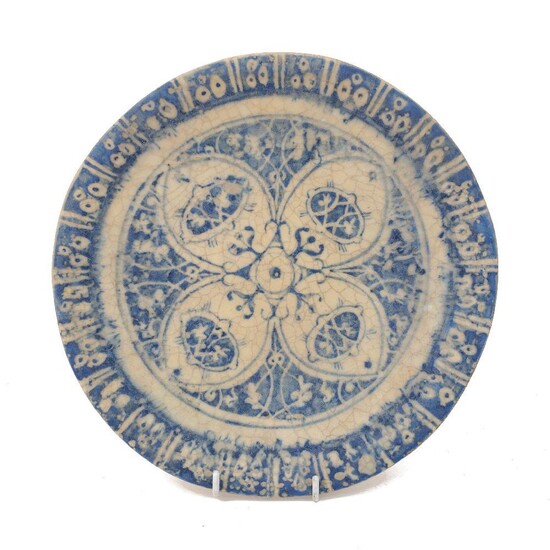 A Safavid-style plate, 20th century, stoneware with painted blue underglaze, 23cm diameter