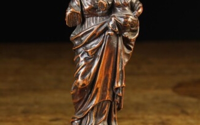 A Small 17th Century Boxwood Carving of Virgin & Child; finely carved and mounted on a moulded plint