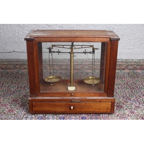 A VINTAGE BRASS WEIGHING SCALES in mahogany and glazed case ...