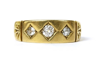 A Victorian 22ct gold three stone diamond ring