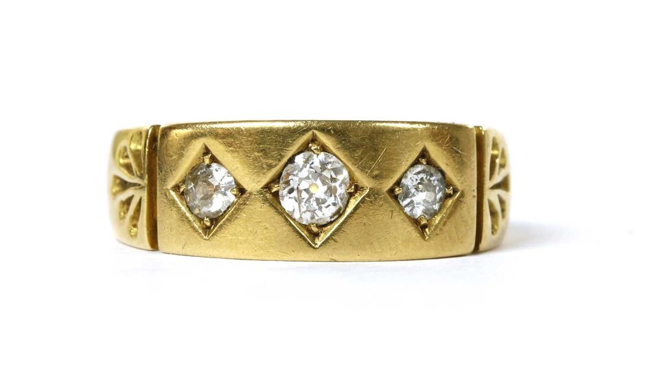 A Victorian 22ct gold three stone diamond ring