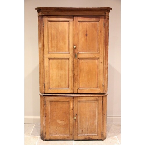A Victorian pine freestanding corner cupboard, the moulded c...