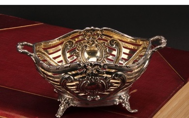 A Victorian silver sweetmeat basket, pierced and embossed wi...