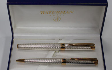 A Waterman silver and gilt metal pen set, comprising roller ball and ballpoint, cased.